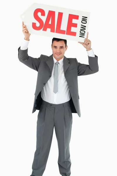 Businessman with sign above his head — Stock Photo, Image