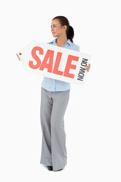 Businesswoman holding sign in front of her — Stock Photo, Image