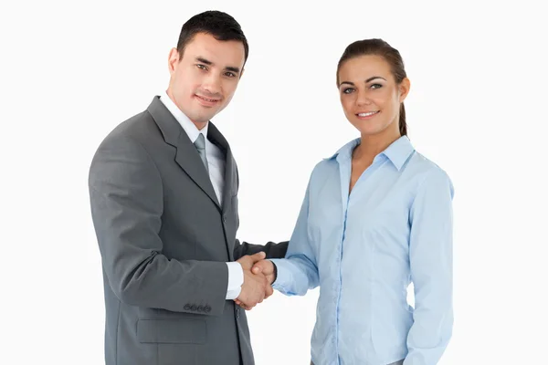 Smiling business partners closing a deal — Stock Photo, Image