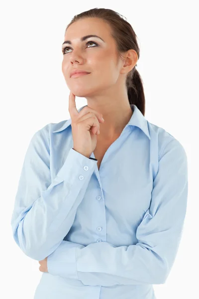 Thinking businesswoman looking diagonally upwards — Stock Photo, Image