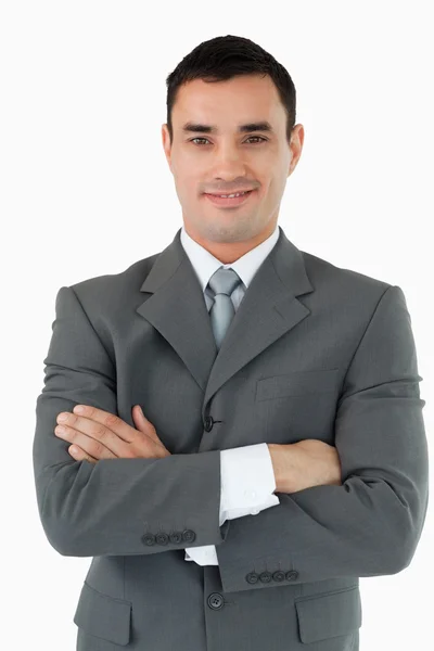 Smiling businessman with his arms folded — Stock Photo, Image