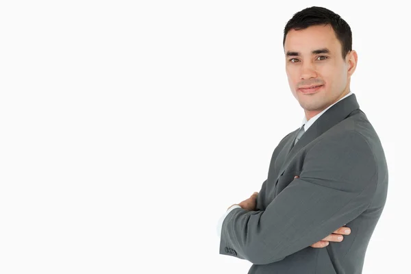 Side view of businessman with arms folded looking to the side — Stock Photo, Image