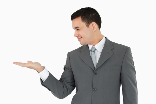Businessman looking at his palm — Stock Photo, Image