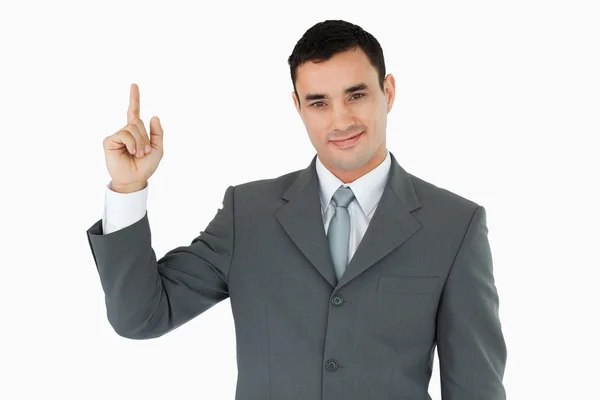 Standing businessman pointing upwads — Stock Photo, Image