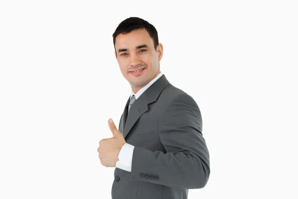 Side view of businessman giving thumb up — Stock Photo, Image