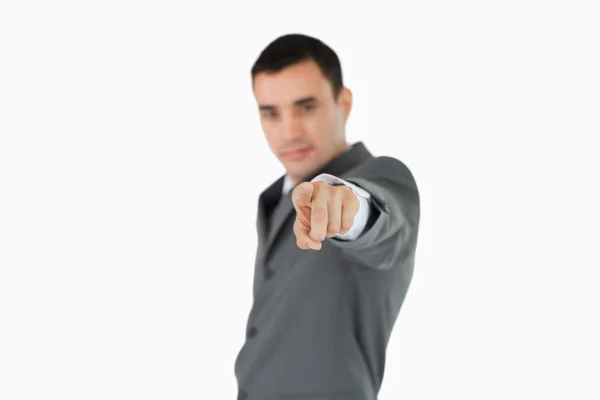 Side view of businessman pointing towards camera — Stock Photo, Image