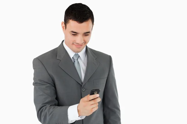 Wysyłanie SMS-ów biznesmen z jego telefon — Zdjęcie stockowe
