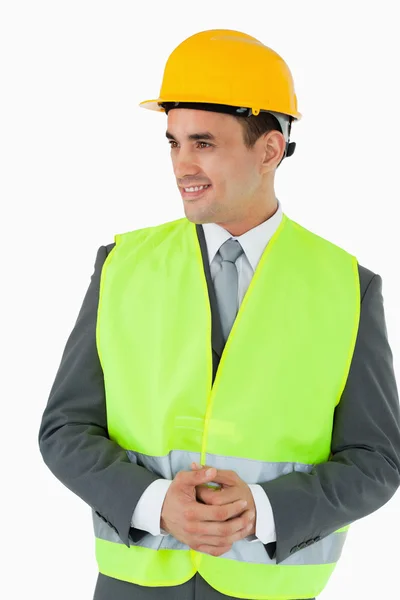 Smiling architect with hands folded looking to the side — Stock Photo, Image