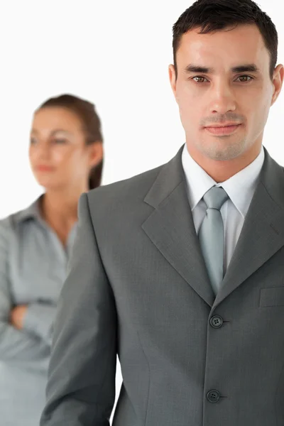 Close up of businessman with colleague behind him — Stock Photo, Image