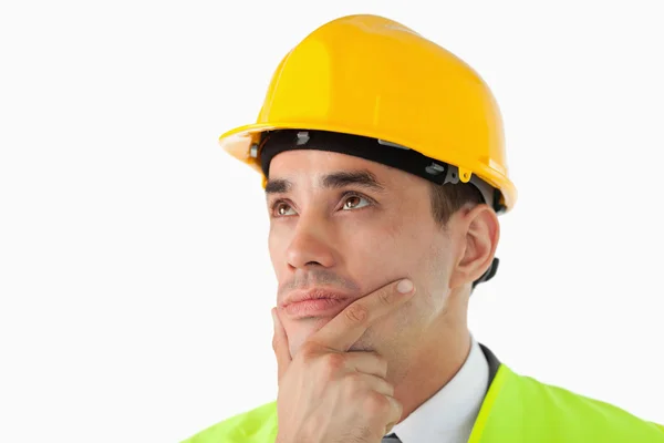 Close up of thinking architect looking to the side — Stock Photo, Image