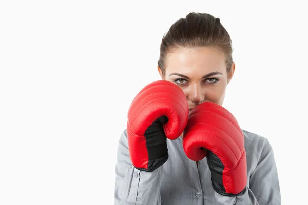 Young businesswoman with boxing gloves — Stock Photo, Image