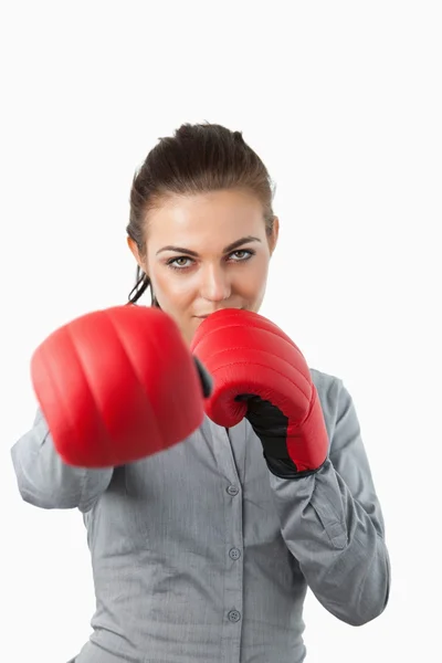 Businesswoman with boxing gloves slamming — Stock Photo, Image