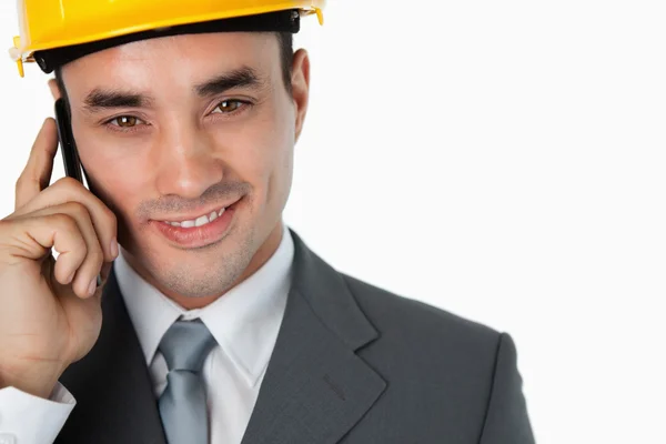 Close up of confident smiling architect on the phone — Stockfoto