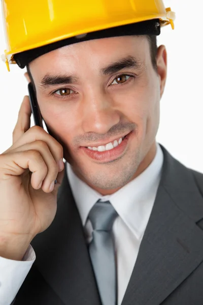 Close up of smiling architect listening to caller — Stock Photo, Image