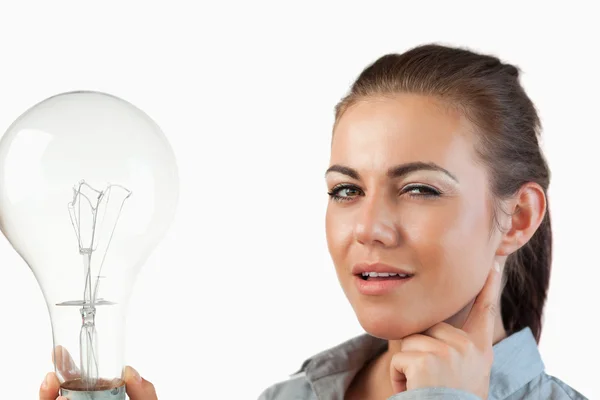 Businesswoman with huge light bulb — Stock Photo, Image