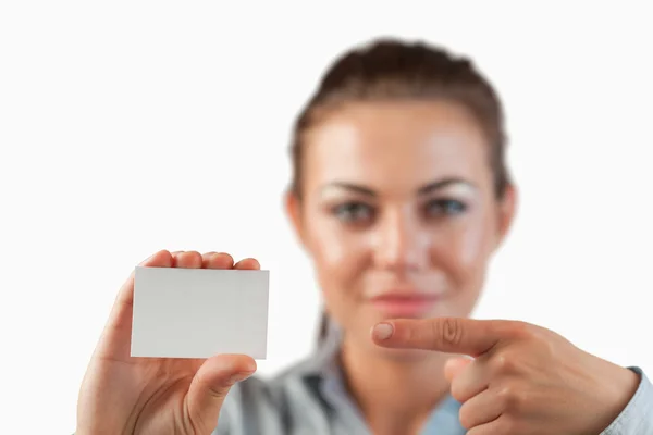 Close up of business card being pointed on by businesswoman — Stock Photo, Image