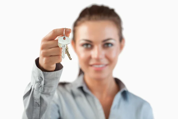 Close up of keys being held by female estate agent — Stock Photo, Image