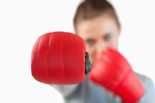 Close up of boxing glove used by businesswoman — Stock Photo, Image