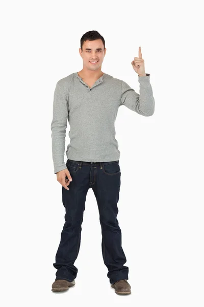 Young male pointing upwards — Stock Photo, Image