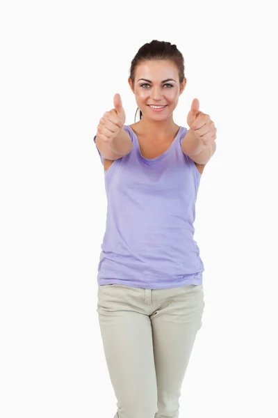 Young female giving thumbs up — Stock Photo, Image