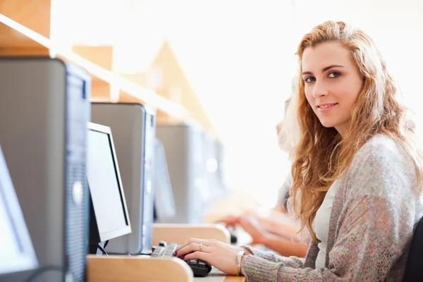 Student posing with a computer Royalty Free Stock Images