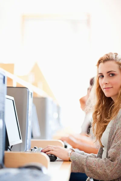 Portrait of a student posing with a computer Stock Picture