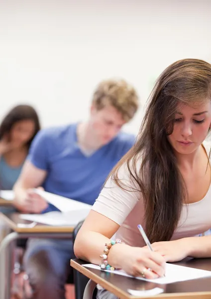 Portrait of students having a test Stock Picture