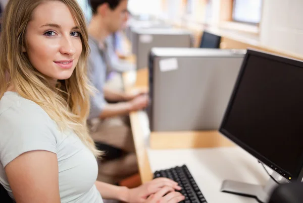Cute student with a computer Stock Image