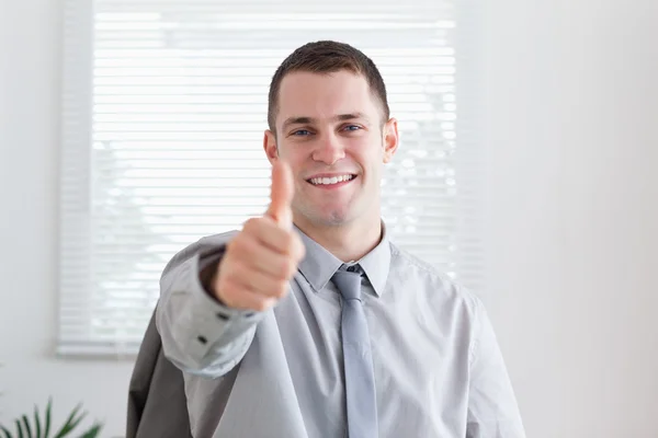Happy businessman giving his approval Stock Photo