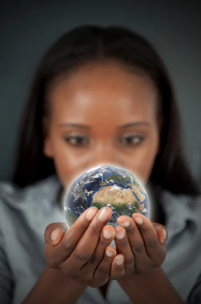 Beautiful woman holding the Earth Stock Photo