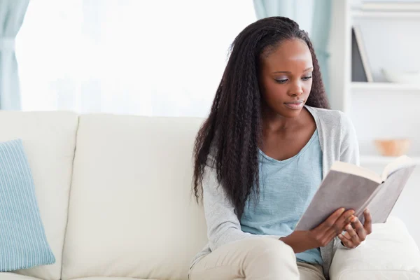 Woman reading a book Stock Image