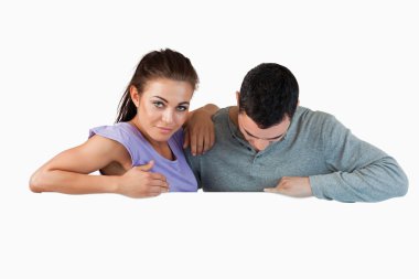 Young couple looking over a wall clipart