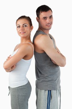 Portrait of a fit couple posing clipart