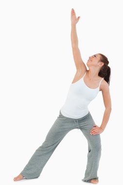 Portrait of a woman in the Utthita Trikonasana position clipart