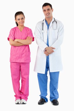 Portrait of a doctor and a nurse posing clipart