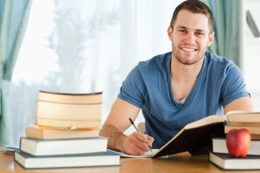 Smiling student preparing for test clipart