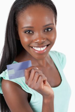 Smiling young woman with her new credit card clipart