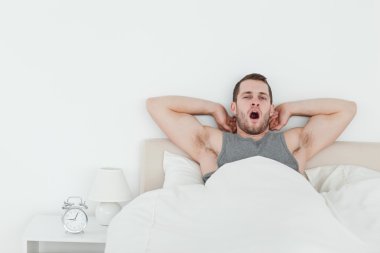 Man yawning while waking up clipart