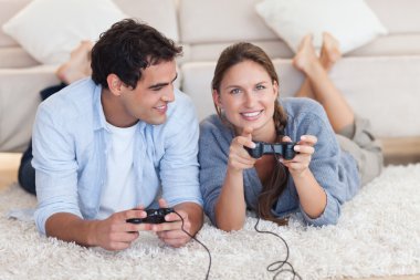 Lovely couple playing video games clipart