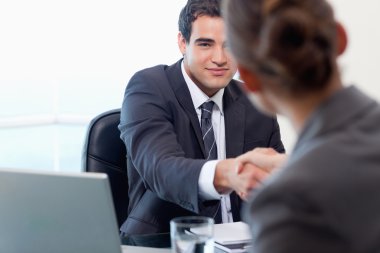 Manager interviewing a female applicant clipart