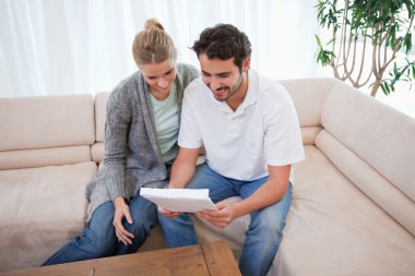 Couple reading a letter clipart