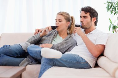 Couple drinking a glass of wine clipart