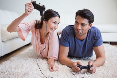 Woman beating her fiance while playing video games clipart