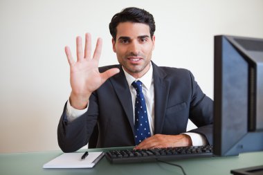 Businessman showing his hand clipart