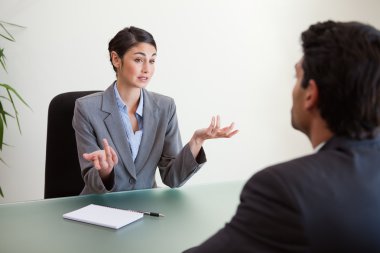 Manager interviewing an employee clipart