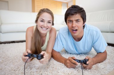 Playful couple playing video games clipart