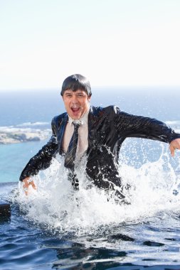 Portrait of a businessman going out of the water clipart