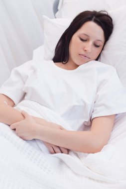 Woman sleeping in the hospital clipart