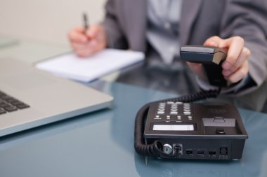 Telephone being hung up by businesswoman clipart