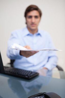 Paperwork being handed over by businessman clipart